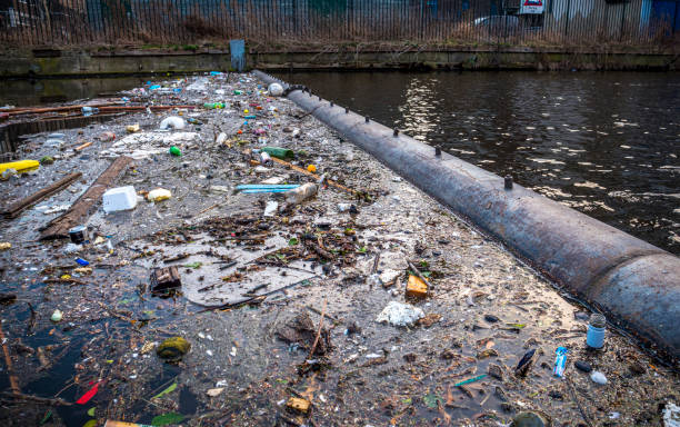 istock Environmental Issue: Plastic in the water, stopped by a barrier 1171720594