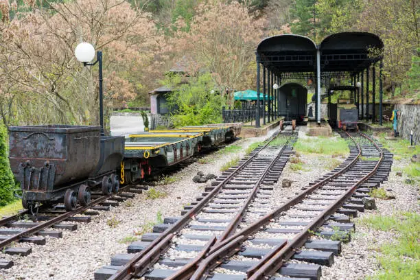 Old vintage railway station with rail, train and platform of narrow gauge railway in Mokra Gora, Serbia. It is near narrow gauge railway called Sargan Eight at Mokra Gora in Serbia which has scenic journeys where train rise upon the hills in the convoluted circles in the shape of number eight.