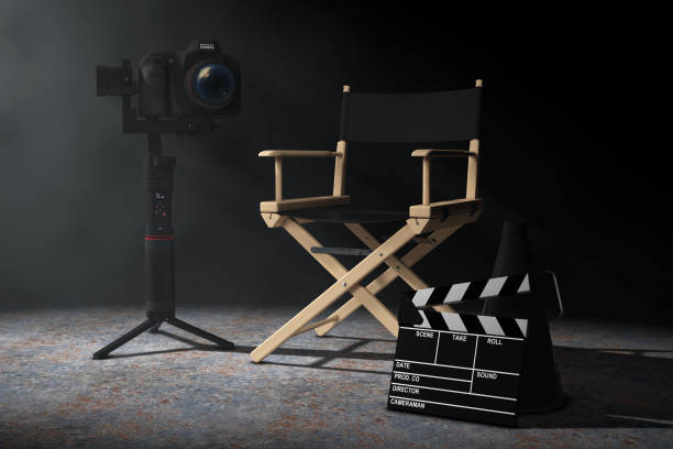 istock Cinema Industry Concept. DSLR or Video Camera Gimbal Stabilization Tripod System near Director Chair, Movie Clapper and Megaphone in the volumetric light. 3d Rendering 1171721529