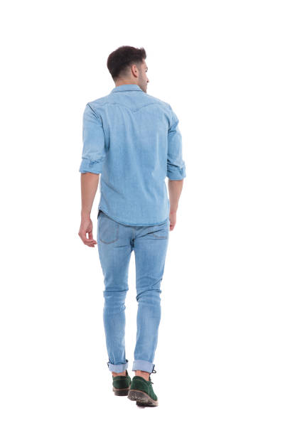 istock back view of young man walking and looking to side 1171722478