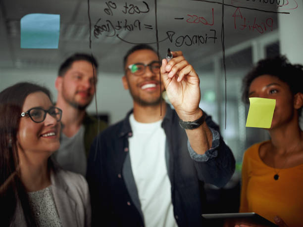 group of diverse successful businesspeople discussing business p - pen business person men standing imagens e fotografias de stock