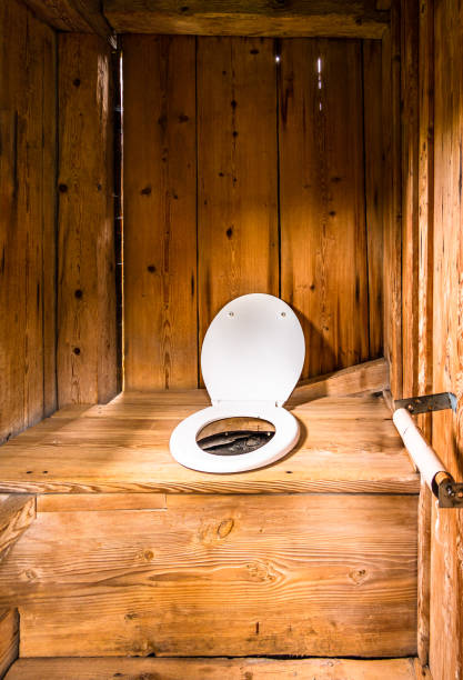 old wooden outhouse indoors an old wooden outhouse outhouse interior stock pictures, royalty-free photos & images
