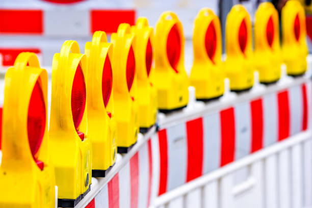 security barrier modern security barrier at a construction site road closed sign horizontal road nobody stock pictures, royalty-free photos & images