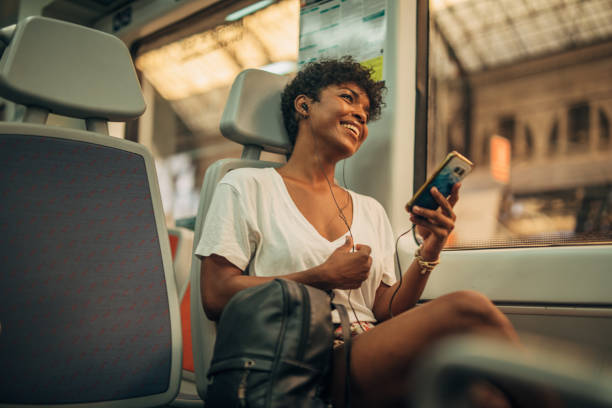 Beautiful lady listening music in train