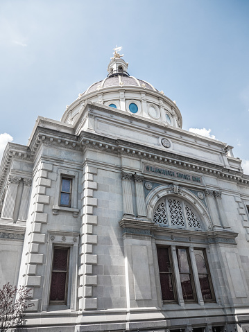 Vintage bank building with classic style architecture and dome in Williamsburg New York.