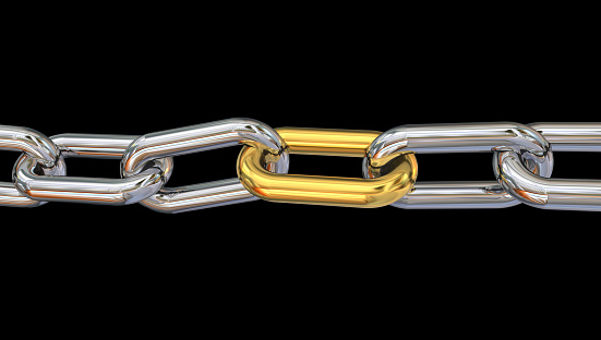 golden link in silver chain isolated in black background - 3d rendering