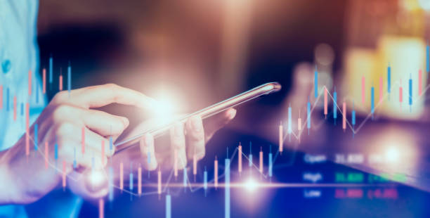 istock Stock exchange market concept, businessman trader looking on smartphone with graphs analysis candle line in office room, diagrams on screen. 1171730228