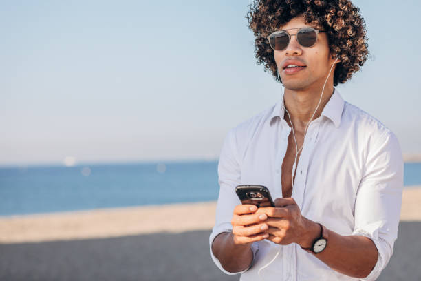 istock Modern guy listening music on headphones 1171730630