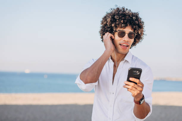istock Modern man listening music on headphones 1171730650