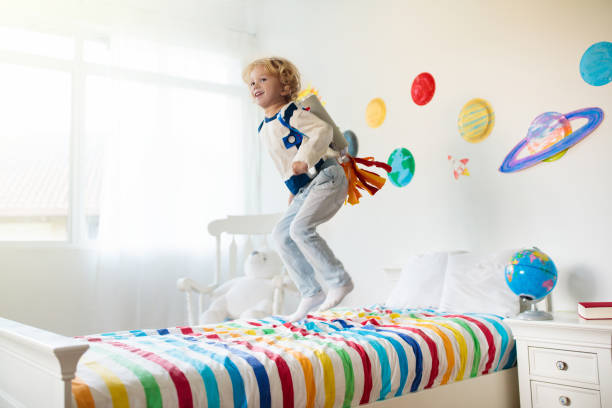 istock Kids play astronaut. Space and planet child game. 1171731265