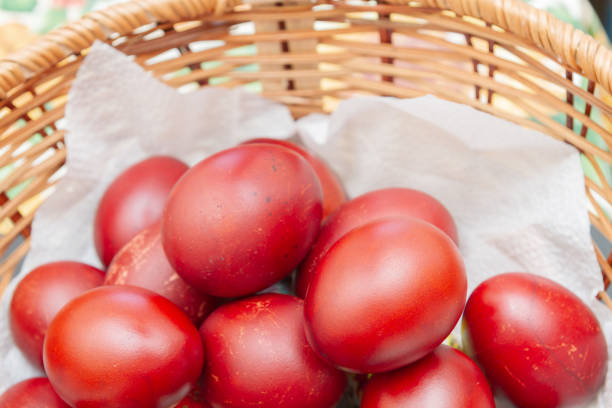 istock Painted eggs in onion peel lay in the wicker basket 1171731659