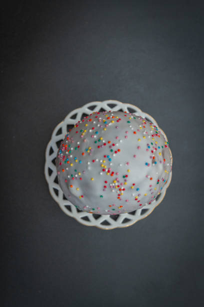 istock Easter spring cake in white glaze with colored sprinkles 1171731682