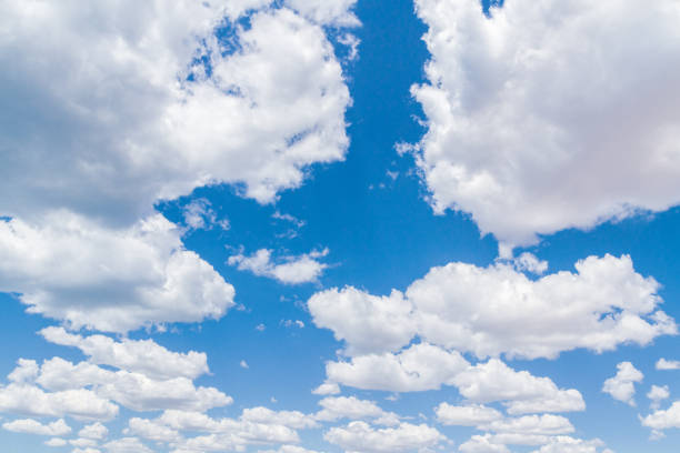 istock White fluffy clouds in the blue sky in summer 1171731899