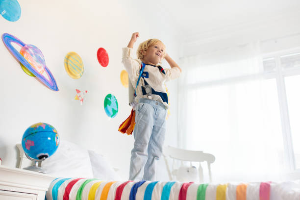 istock Kids play astronaut. Space and planet child game. 1171732273