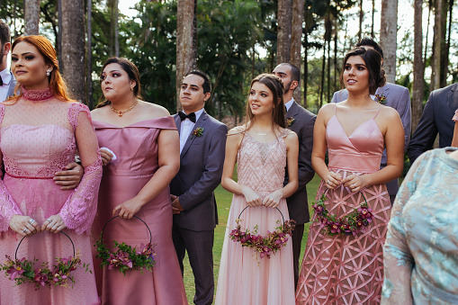 Emotional bridesmaid and wedding guests