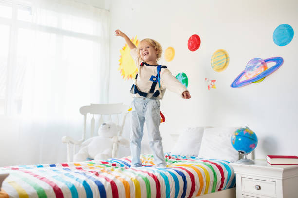 istock Kids play astronaut. Space and planet child game. 1171733864