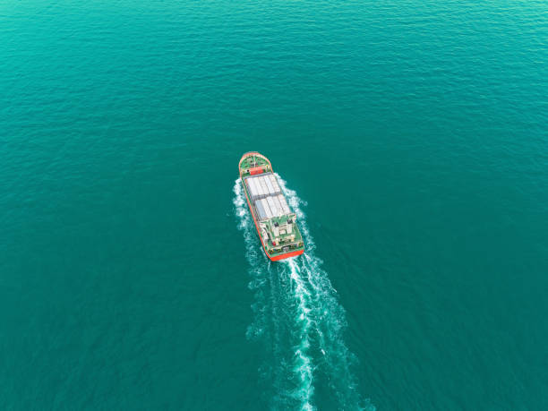 istock Aerial view Small Container ship on the sea for logistics, import export, shipping or transportation. 1171734629