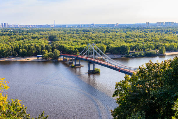 View on pedestrian bridge across the Dnieper river in Kiev, Ukraine View on pedestrian bridge across the Dnieper river in Kiev, Ukraine dnieper river stock pictures, royalty-free photos & images