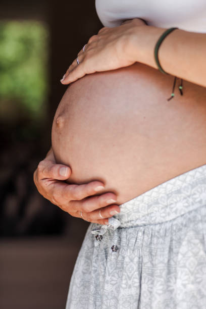 istock Unrecognizable pregnant woman holding her stomach 1171736307