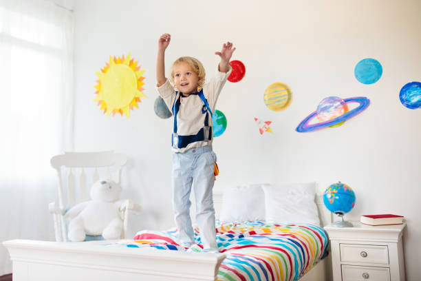 istock Kids play astronaut. Space and planet child game. 1171736551