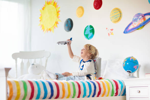 istock Kids play astronaut. Space and planet child game. 1171736593