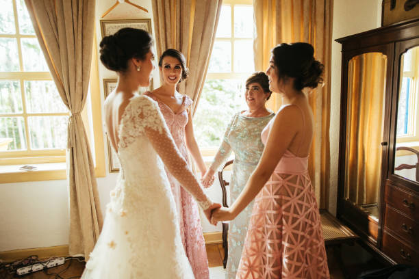 Bridesmaids and bride praying before wedding ceremony Bridesmaids and bride praying before wedding ceremony mom and sister stock pictures, royalty-free photos & images