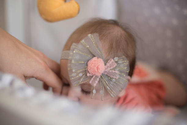 istock Beautiful baby girl playing on bed 1171736994