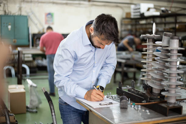 istock The engineer oversees the process of working in an electrical workshop,stock photo 1171737659