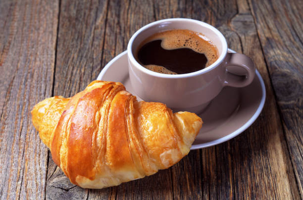 istock Hot coffee and a croissant 1171738207
