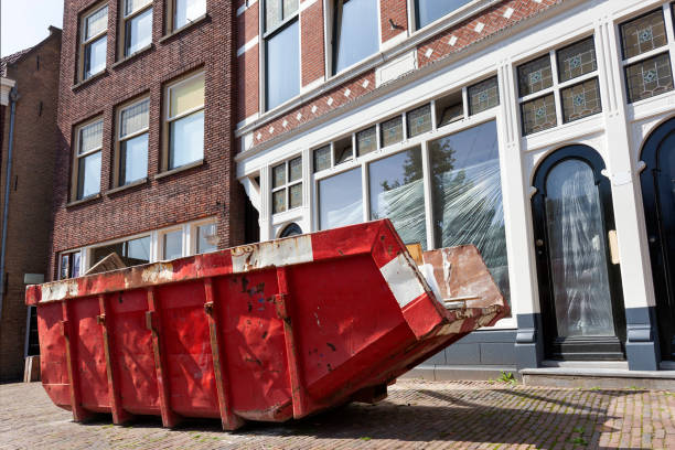 Red skip in a street in Rotterdam Red skip for dumping renovation waste in a street in Rotterdam industrial garbage bin photos stock pictures, royalty-free photos & images