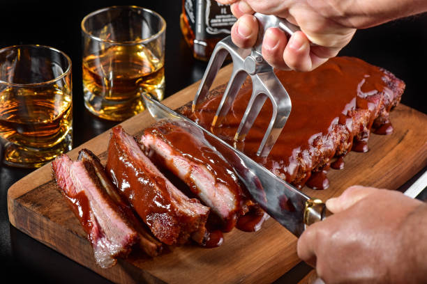 istock Barbecue sauce ribs on rustic cutting board 1171739173
