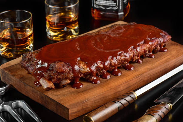 istock Barbecue sauce ribs on rustic cutting board 1171739235