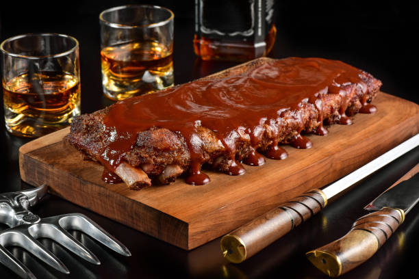 istock Barbecue sauce ribs on rustic cutting board 1171739316