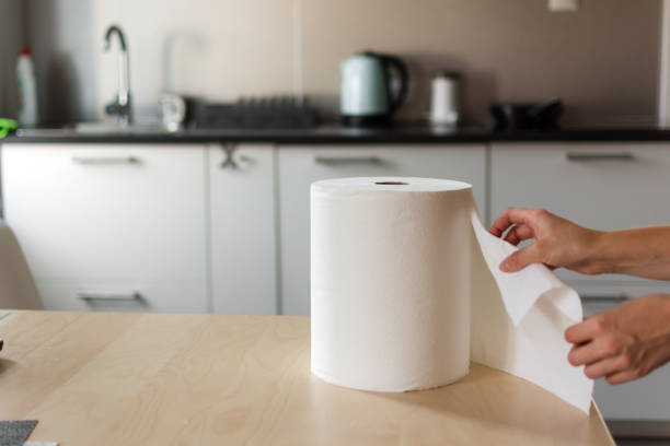 Huge roll of paper towels on kitchen table. Huge roll of paper towels on kitchen table. paper towel stock pictures, royalty-free photos & images