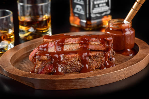 istock Barbecue sauce ribs on rustic cutting board 1171741863
