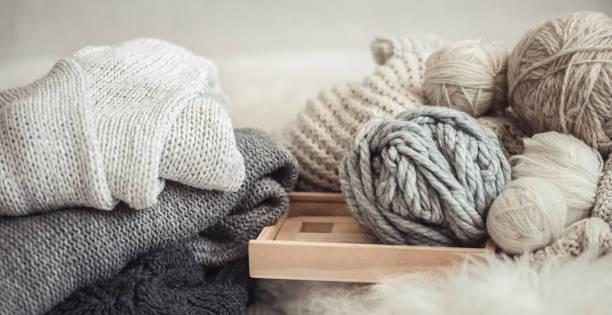istock cozy background Wallpaper with the yarn for knitting. 1171744265