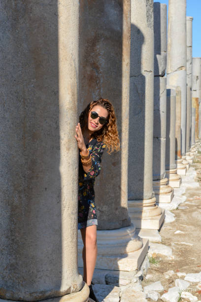 Smiling woman in ancient city.