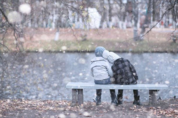 istock Kids walk in the park first snow 1171744661
