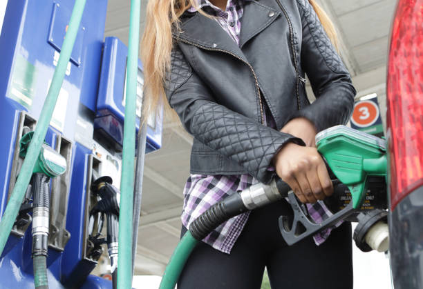 istock Young woman refuels her car 1171746370