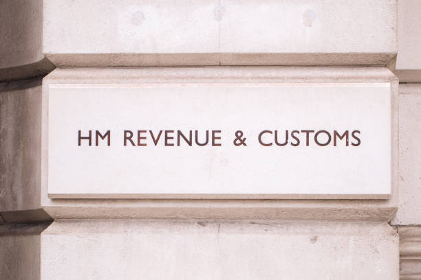 Simple carved lettering of HM revenue & Customs outside the Westminster offices in London. UK Simple carved lettering of HM revenue & Customs outside the Westminster offices in London. UK hm government stock pictures, royalty-free photos & images