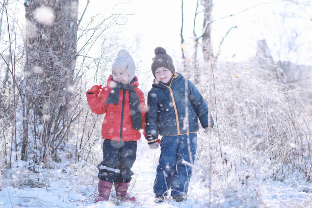 istock Kids walk in the park first snow 1171747784