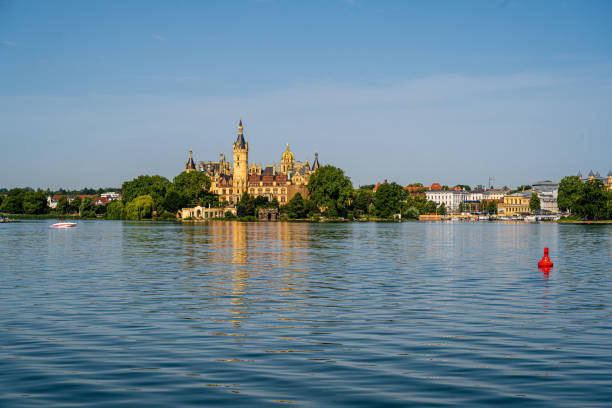 City of Schwerin Germany, seen from the lake. Landscape photo overlooking Schwerin from the lake on a beautiful summer morning. schwerin castle stock pictures, royalty-free photos & images