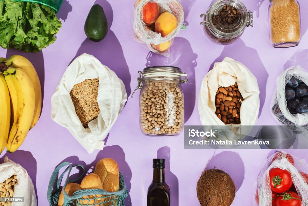 Zero-waste healthy grocery shopping concept:  pulses, fruits, greens and vegetables in mesh net or cotton bags and glass jars Pantry Stock Photo