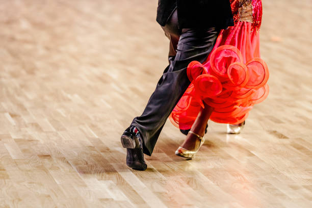 Young dancing pair in classical suits
