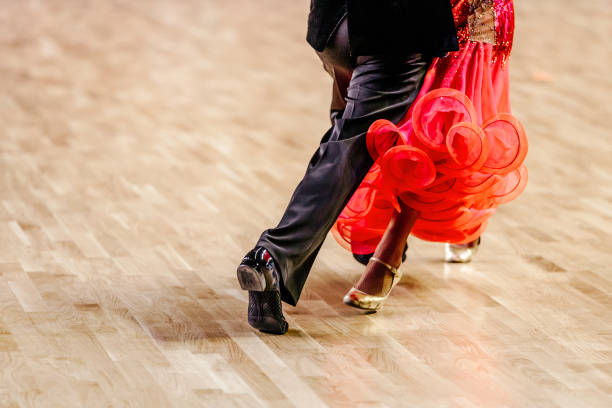 legs man and woman dancers legs man and woman dancers on parquet floor ballroom dancing rumba photos stock pictures, royalty-free photos & images