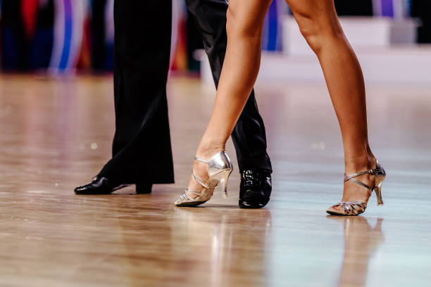 elegant legs dancers man and woman elegant legs dancers man and woman on dance floor rumba photos stock pictures, royalty-free photos & images