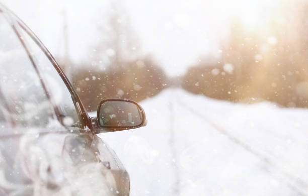 istock Car on a snowy winter road in fields. 1171752979