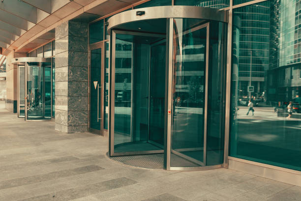 Curved doorway to the office, bank, corporation. Glass and metal doors. Curved doorway to the office, bank, corporation. Glass and metal doors bank entrance stock pictures, royalty-free photos & images