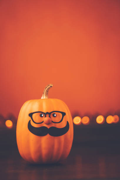 istock Halloween background with cute mustached pumpkin character 1171754895