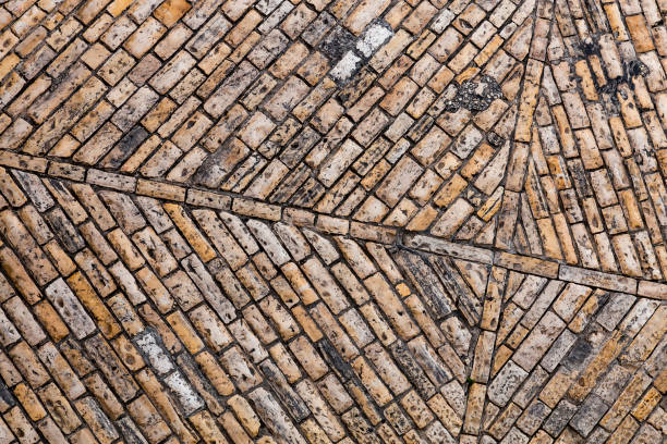 istock Cobble paving stone brick sidewalk of old town. Abstract background. 1171756261